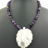Unusual carved mother of pearl  pendant on amethyst necklace. PRICE REDUCED
