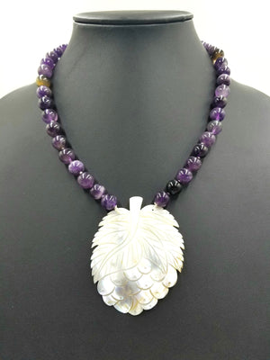 Unusual carved mother of pearl  pendant on amethyst necklace. PRICE REDUCED