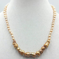 Ombre pearl necklace on white silk with 14K white gold clasp. 20.5" length.  Matinee.