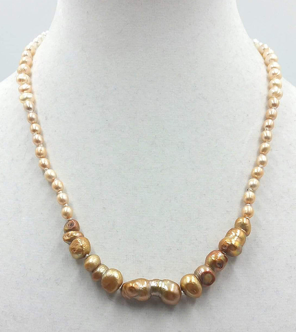 Ombre pearl necklace on white silk with 14K white gold clasp. 20.5" length.  Matinee.