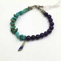 Very pretty. Turquoise, howlite, fluorite, sterling, lapis lazuli, toggle bracelet. 7" Length.