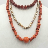 "Etna's Descendants" A 3-strand, sponge coral, pearl, carnelian necklace  with Sterling Silver accents & clasp. At Angst Art Gallery, Vancouver, WA