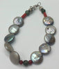 Past Work. Freshwater pearl, coral, nephrite, sterling silver bracelet. Sold.