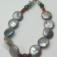Past Work. Freshwater pearl, coral, nephrite, sterling silver bracelet. Sold.