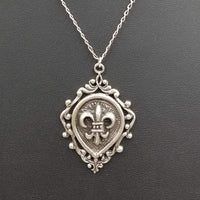 Bold, sterling silver, fleur d' lis pendant necklace. 17.5" Princess length. Vegan.