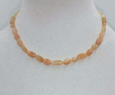 Butterscotch candy? No, it is a sunstone graduated necklace on yellow silk with 10K gold clasp. 16