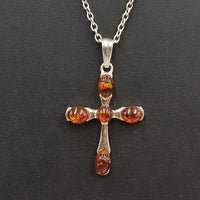 SOLD, Bold Baltic amber & sterling silver cross pendant on long chain.