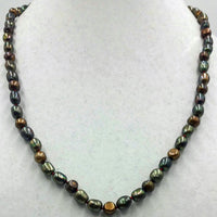 Bronze pearl necklace, matinee length on scarlet silk.