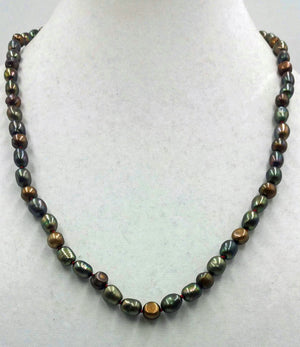 Bronze pearl necklace, matinee length on scarlet silk.