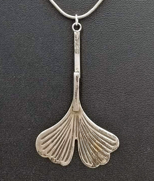 Sterling silver ginkgo leaf pendant necklace.