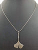 Sterling silver ginkgo leaf pendant necklace.