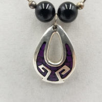 Liquid Sterling silver, onyx & enamel Thunderbird pendant necklace. Opera length, 28". Vegan.