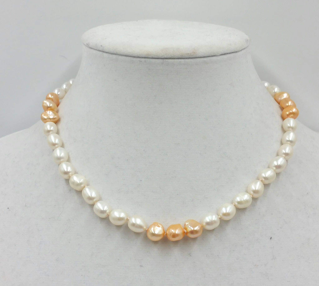 2-tone pearl choker with sterling silver clasp and accents on beige silk. 17in length.
