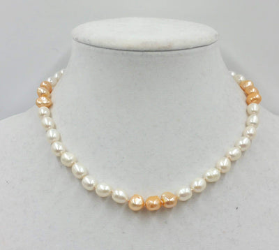 2-tone pearl choker with sterling silver clasp and accents on beige silk. 17in length.