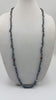 Multi-tone peacock pearl necklace on navy silk. 41" rope length