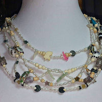 Past Work. Wild & Beautiful. Rice pearls & so much more on this fetish necklace. Sold.