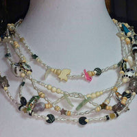Past Work. Wild & Beautiful. Rice pearls & so much more on this fetish necklace. Sold.
