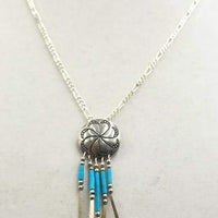 Turquoise and sterling silver concho pendant necklace.