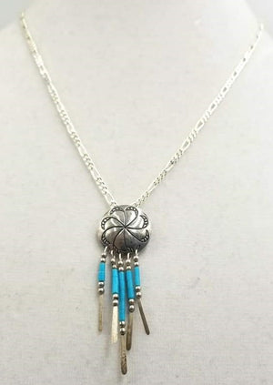 Turquoise and sterling silver concho pendant necklace.