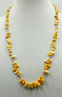 Baltic yolk amber, amethyst, and 14KYG necklace on pink silk.