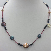 Garnet, tourmaline, lapis and multicolor pearl necklace with 14KYG clasp on scarlet silk.