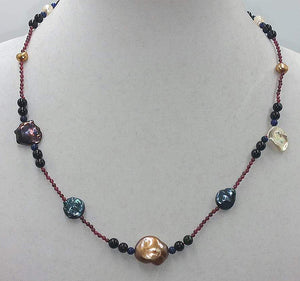 Garnet, tourmaline, lapis and multicolor pearl necklace with 14KYG clasp on scarlet silk.