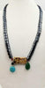 "Cave of Wonders" Bold! Hematite, agate, dyed quartz, onyx, howlite sterling accent necklace on raspberry silk. 32" Opera Length