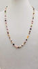 Stunning! Pearl & Garnet necklace on bright red silk with 14KYG clasp. 27" Opera length.