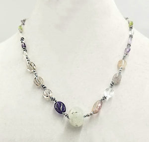 So pretty! Amethyst, citrine, clear quartz, & peridot necklace, with prehnite focal. Hand-knotted with blue silk.