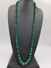 Graduated rope of vintage malachite, on hand-knotted silk necklace. 39" Length.