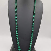 Graduated rope of vintage malachite, on hand-knotted silk necklace. 39" Length.