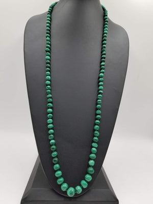 Graduated rope of vintage malachite, on hand-knotted silk necklace. 39" Length.