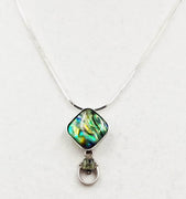 Sterling silver, abalone, and peridot pendant necklace.