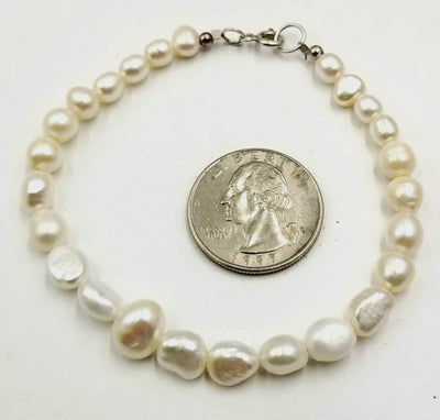 Plus size sterling silver, graduated white pearl bracelet. Classic!