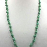 Opera length.  aventurine necklace with sterling accents and clasp on verde silk. 29.5" Opera length.