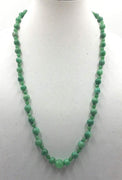 Opera length.  aventurine necklace with sterling accents and clasp on verde silk. 29.5" Opera length.