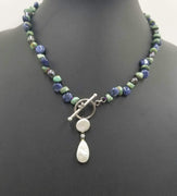 Vintage Nevada turquoise, bi-tone pearl, sterling toggle necklace on purple silk.