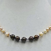 Past Work. Adjustable choker made of cultured pearls. Sterling Silver clasp. 13.5 - 17.25" length. Sold.
