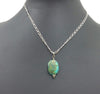 Turquoise-dyed howlite pendant on a sterling silver chain. SOLD