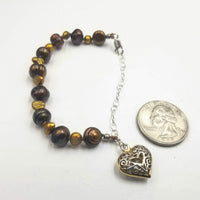 Bronze & brasstone pearl bracelet with sterling silver heart. Adjustable.