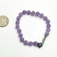 Lavender jadeite, blue sapphire 10KWG bracelet on sky blue silk. Very pretty. 7.5" length.