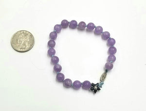 Lavender jadeite, blue sapphire 10KWG bracelet on sky blue silk. Very pretty. 7.5" length.