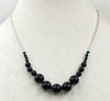 Graduated Black onyx & sterling silver necklace on verde silk.