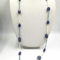 Ultra long art deco inspired freshwater cultured pearls, lapis lazuli, and sterling silver necklace.