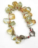 Rutilated Quartz, sterling silver toggle bracelet on scarlet silk.