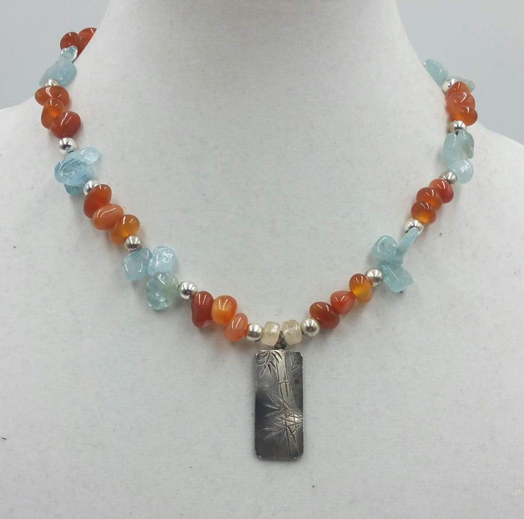 Past Work. Carnelian, blue quartz, and sterling silver bamboo pendant necklace. Donated to charity.