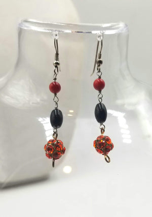 Sterling silver, onyx, coral, and red rhinestones earrings.