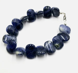 Past Work. If you love blue this is for you! Sodalite bracelet, with sterling silver clasp. 6 7/8" length. Vegan. Sold.