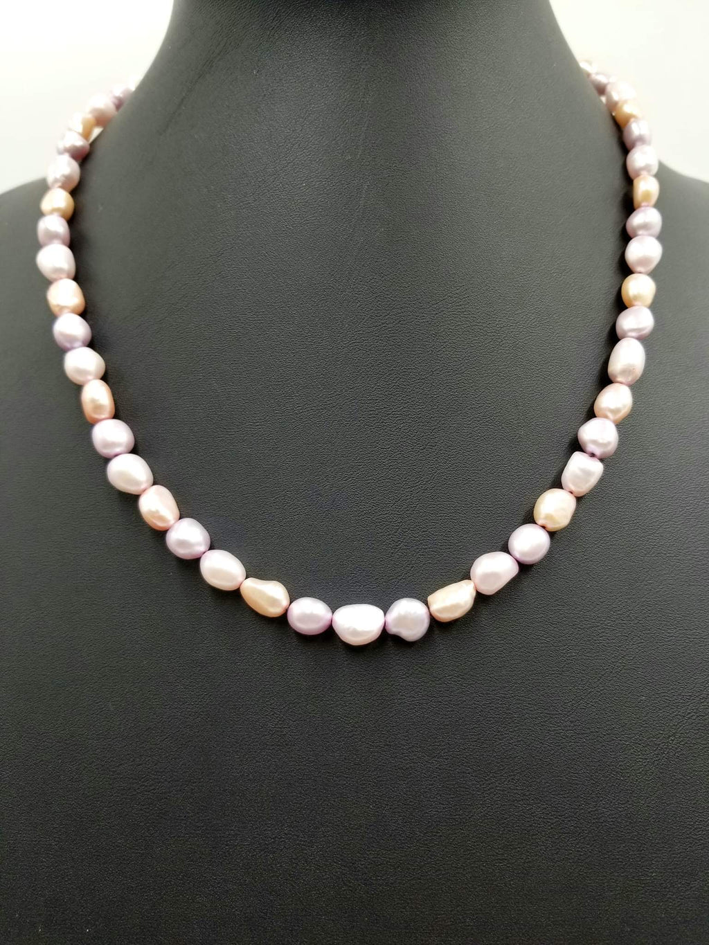 Variegated pink Pearls, hand-knotted on silk with 14Kyellow gold clasp and accents.  Necklace. 20.5" Length.
