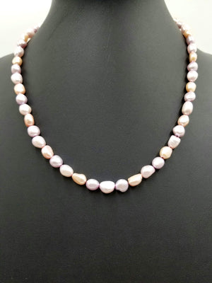 Variegated pink Pearls, hand-knotted on silk with 14Kyellow gold clasp and accents.  Necklace. 20.5